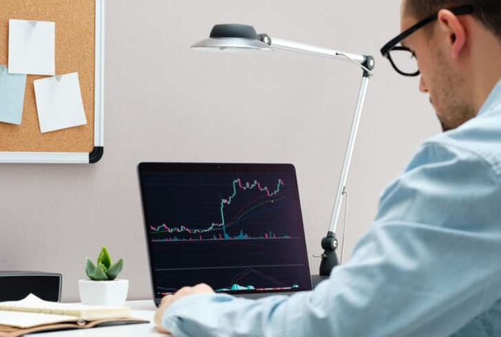 Investor watching rising stock trends